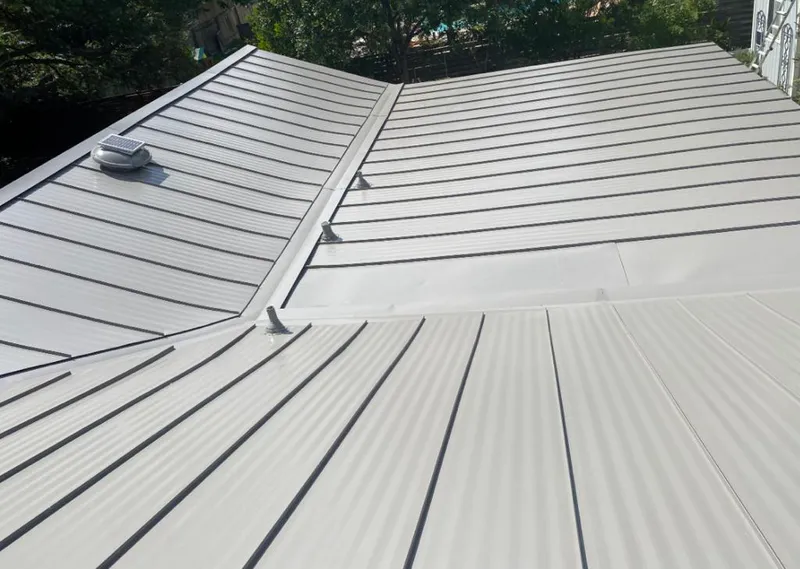 Solar attic fan installed on a metal roof for Roof Ventilation in Dentsville
